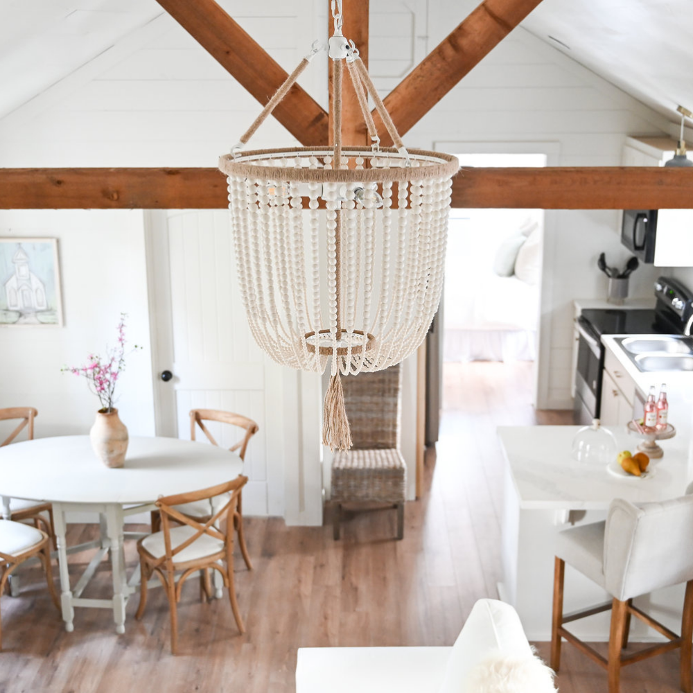 Interior photo of Rolling Acres series home with custom light fixture